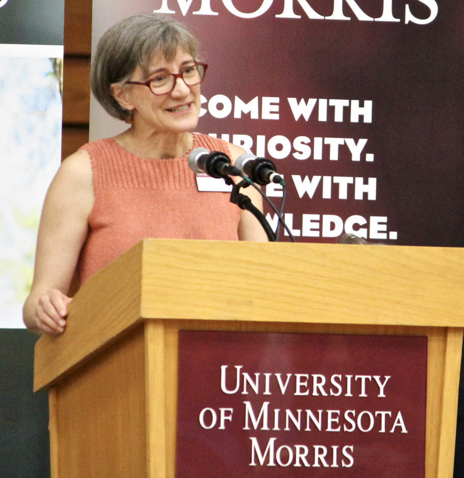 Janet Ericksen speaks at a podium at the University of Minnesota Morris