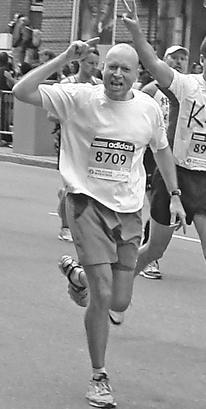 Black and white photo of Professor Mitch Zamoff running in a marathon
