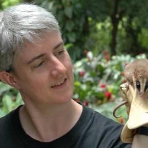 Professor Sharon Jansa, outdoors, holding a platypus
